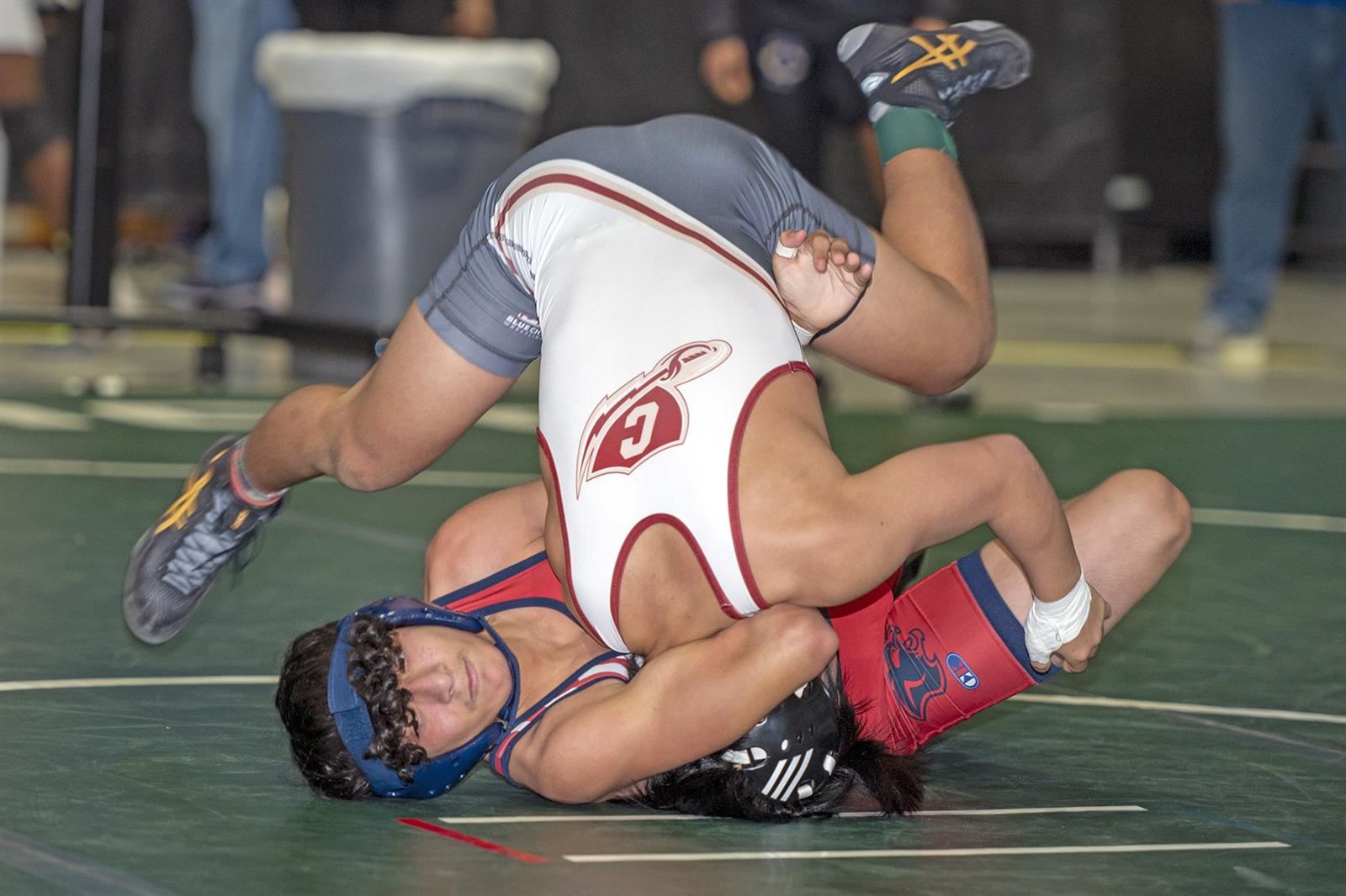Cy Springs High School’s Christian Magana, in red, faces Keller Central High School’s Kody Tanimoto in a 113-pound match.